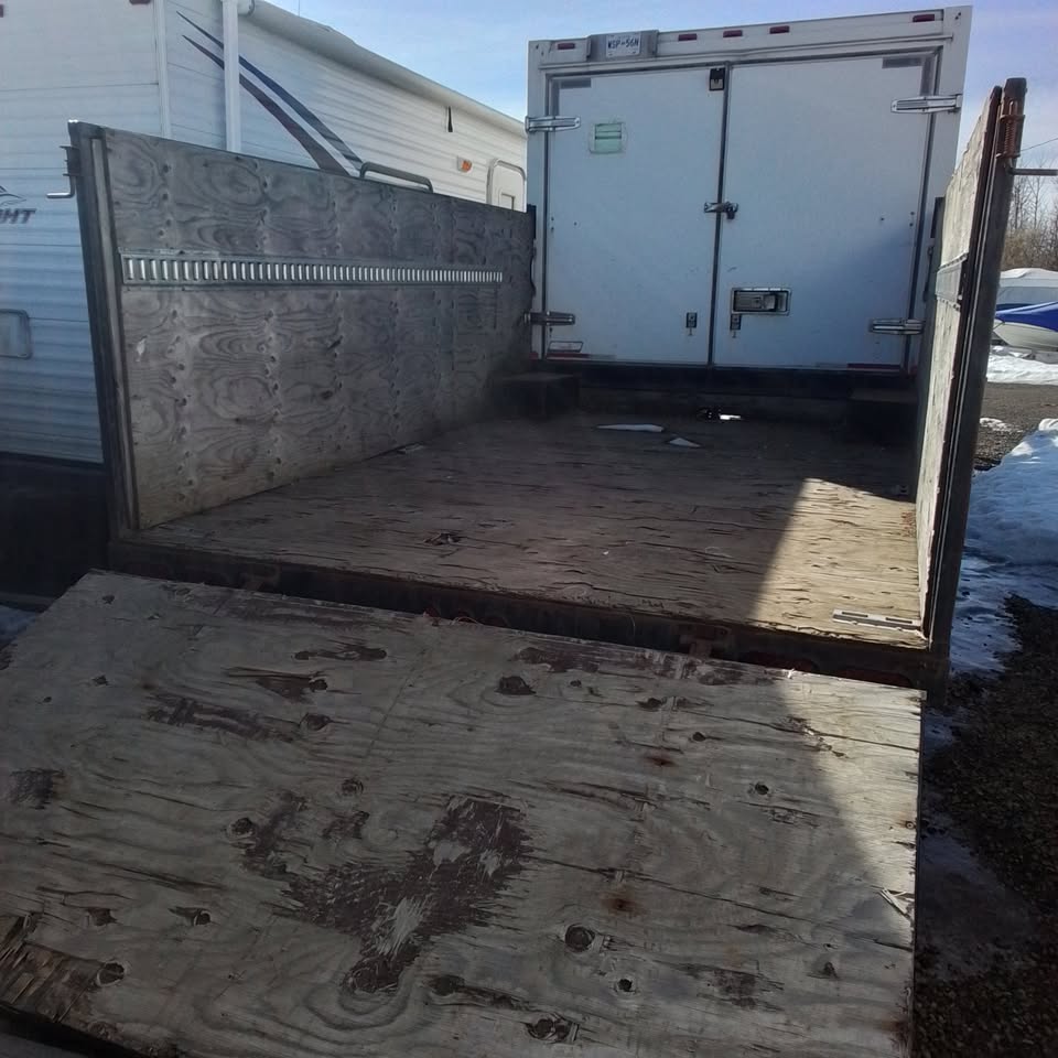 Open trailer deck and rear ramp used for loading debris, equipment and bulky materials.